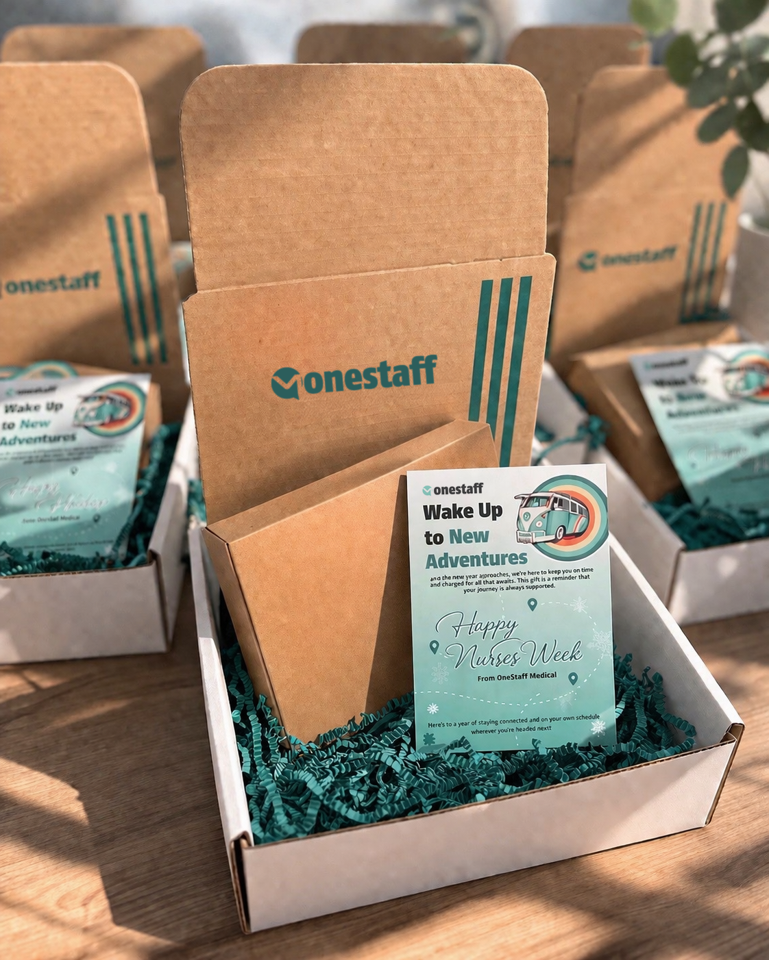 OneStaff Medical 'Wake Up to New Adventures' Nurses Week gift boxes with branded mailer cards and crinkle fill